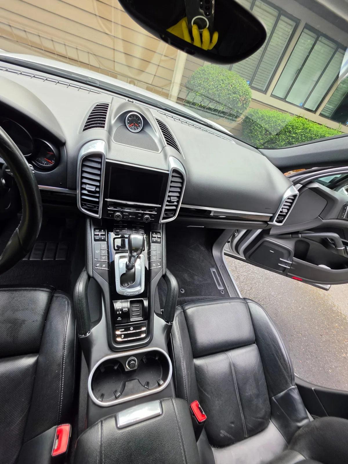 Porsche Cayenne luxury SUV interior dashboard and leather seats after detailing