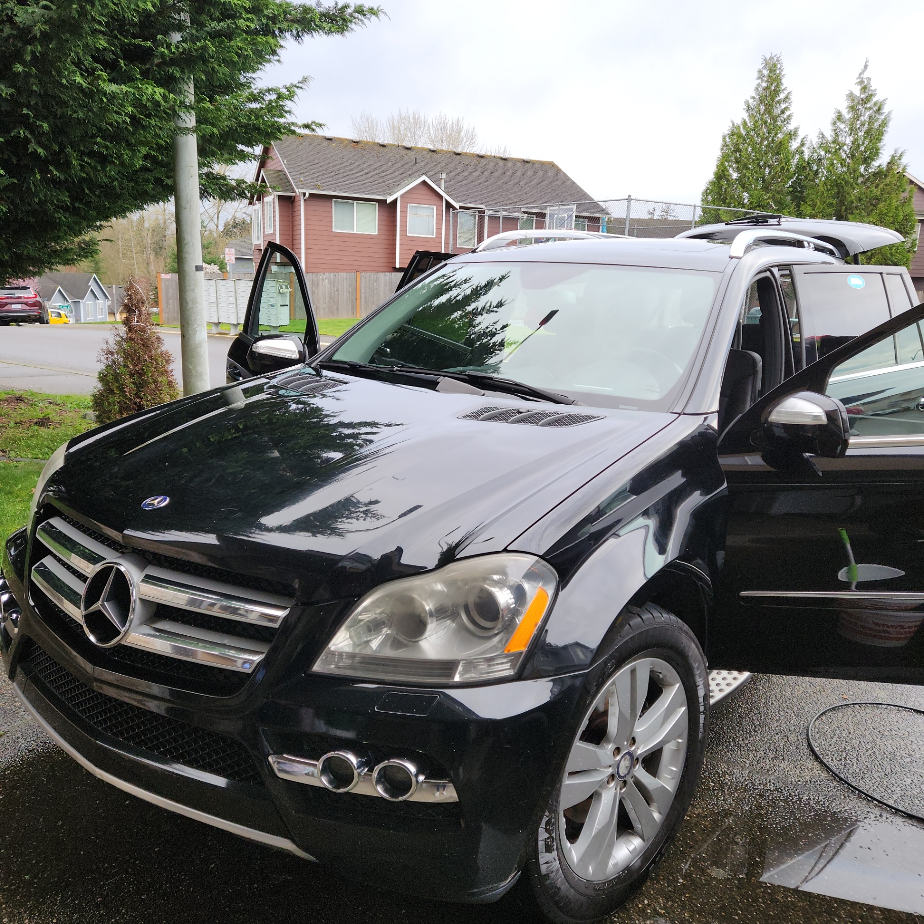 Black Mercedes SUV with open door