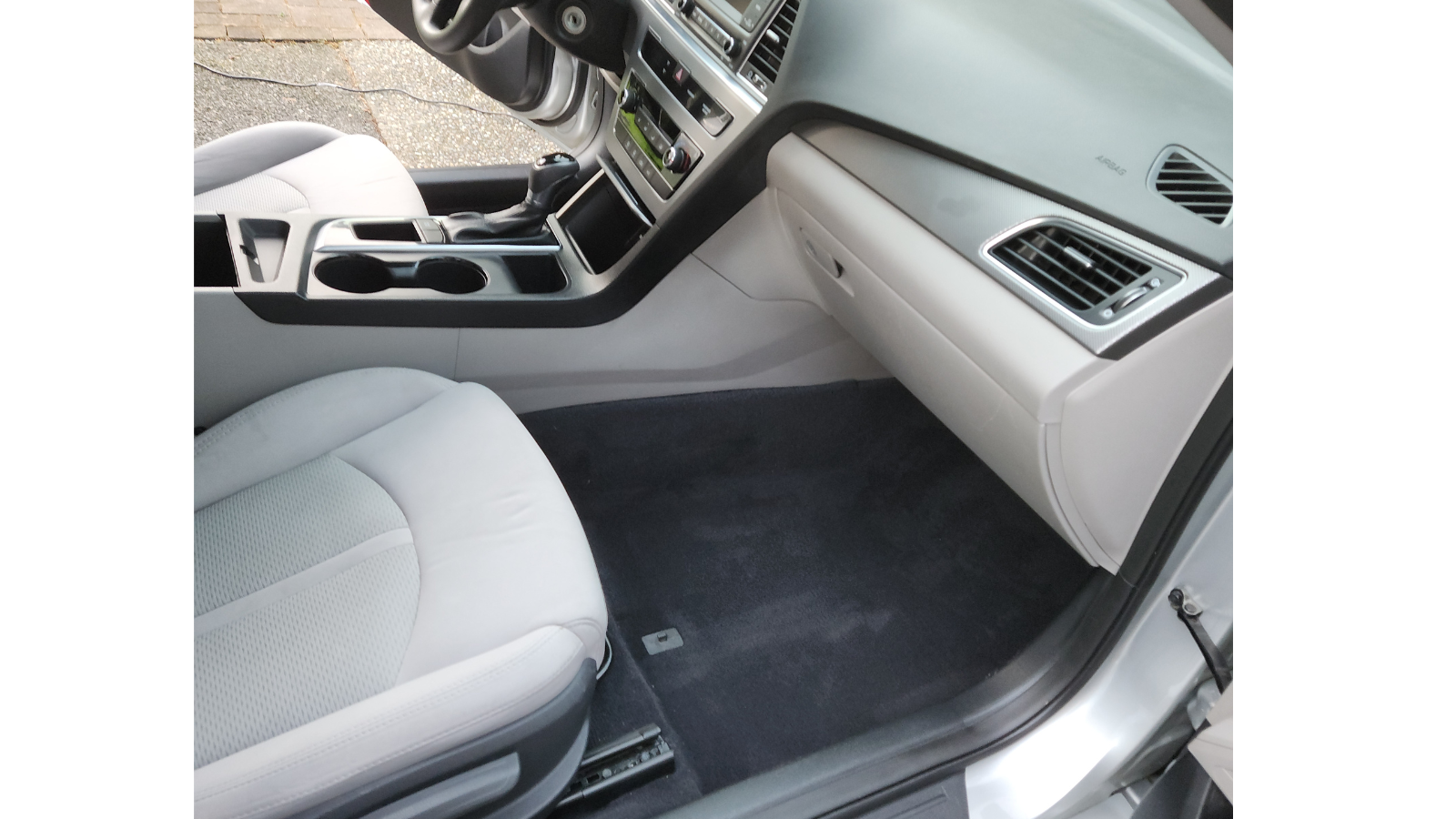 Clean light interior with pristine flooring and seats