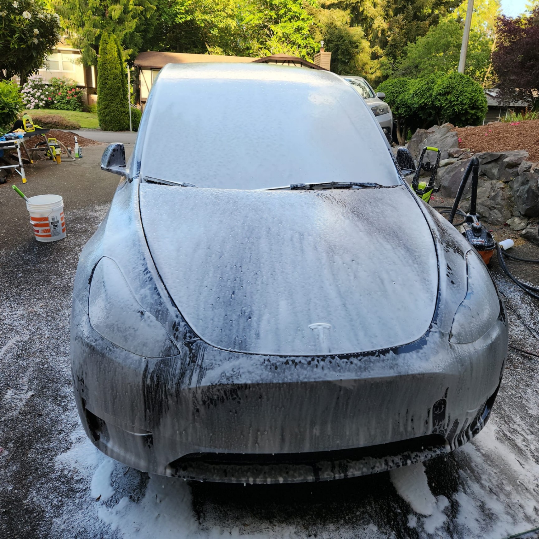 Tesla Model 3 covered in soap during wash process